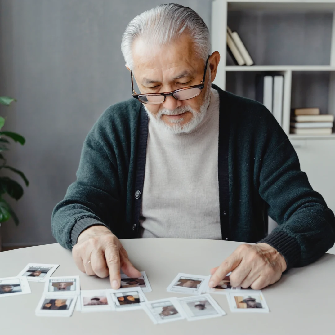 An older adult being supported through a conversation related to best busy boxes for dementia patients